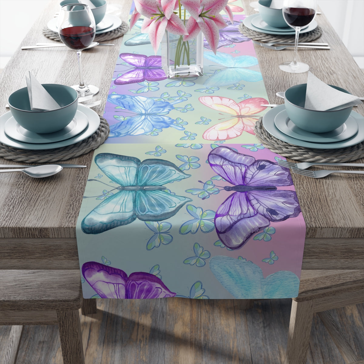 Dining table setting with a colorful butterfly-patterned table runner.