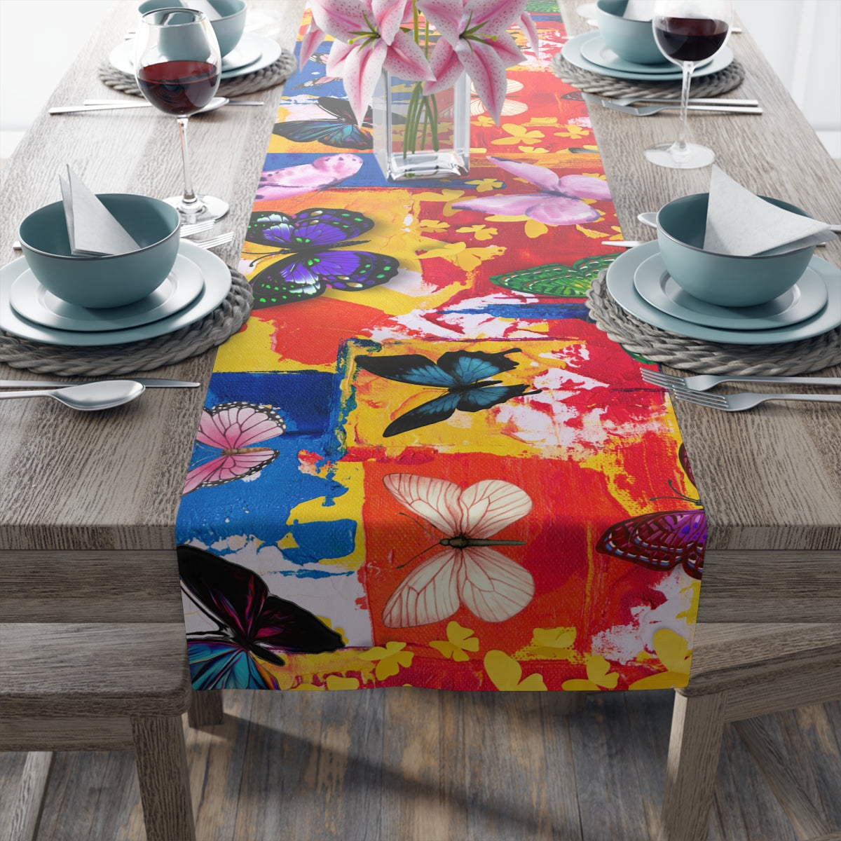 Colorful butterfly-patterned table runner on a wooden table with dining setup.