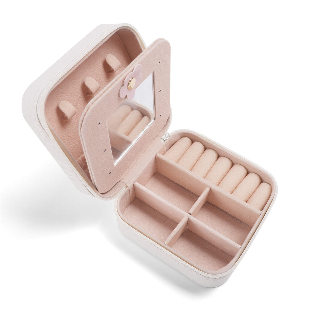 Pink jewelry case with compartments on a white background