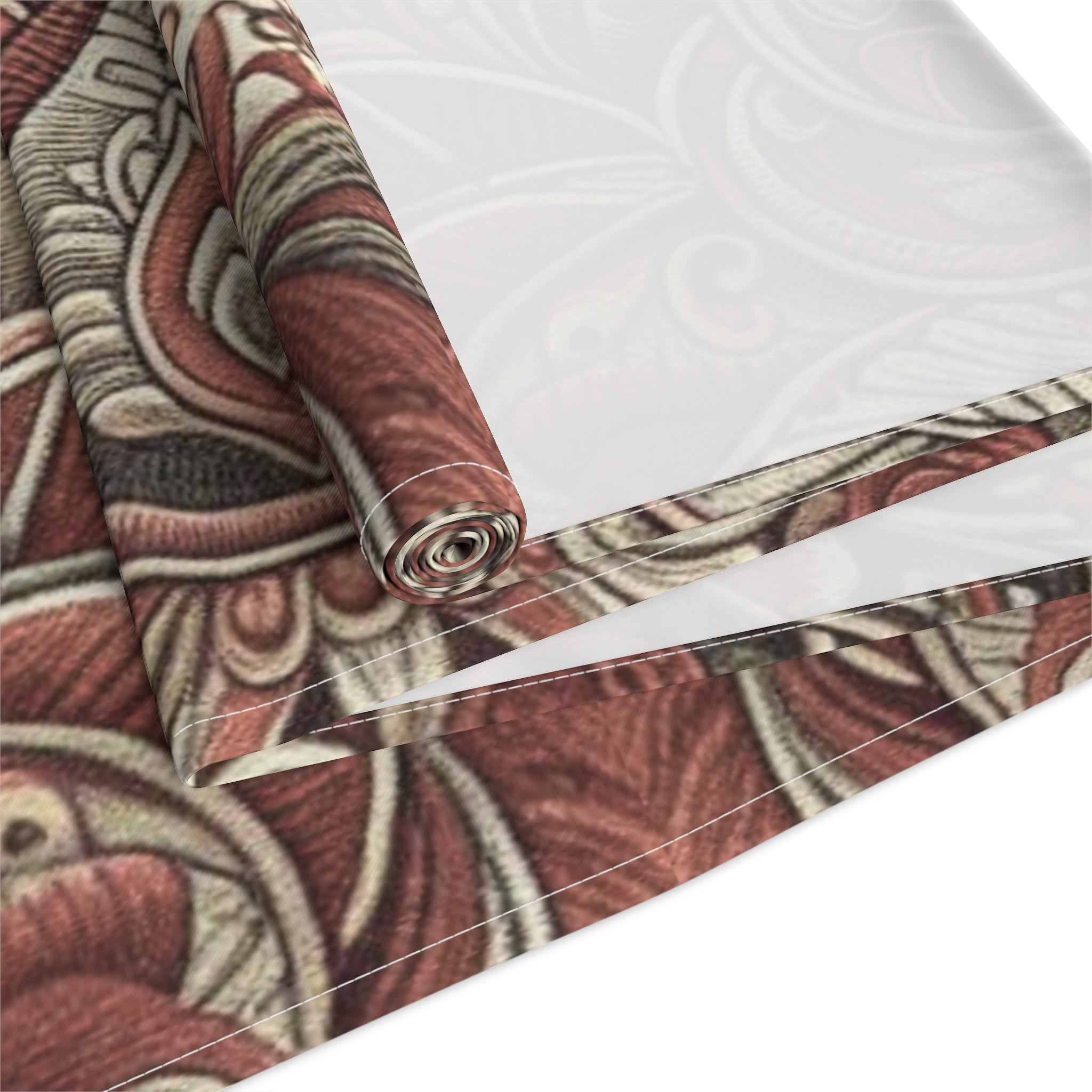 Roll of patterned fabric with red and beige design on a white background