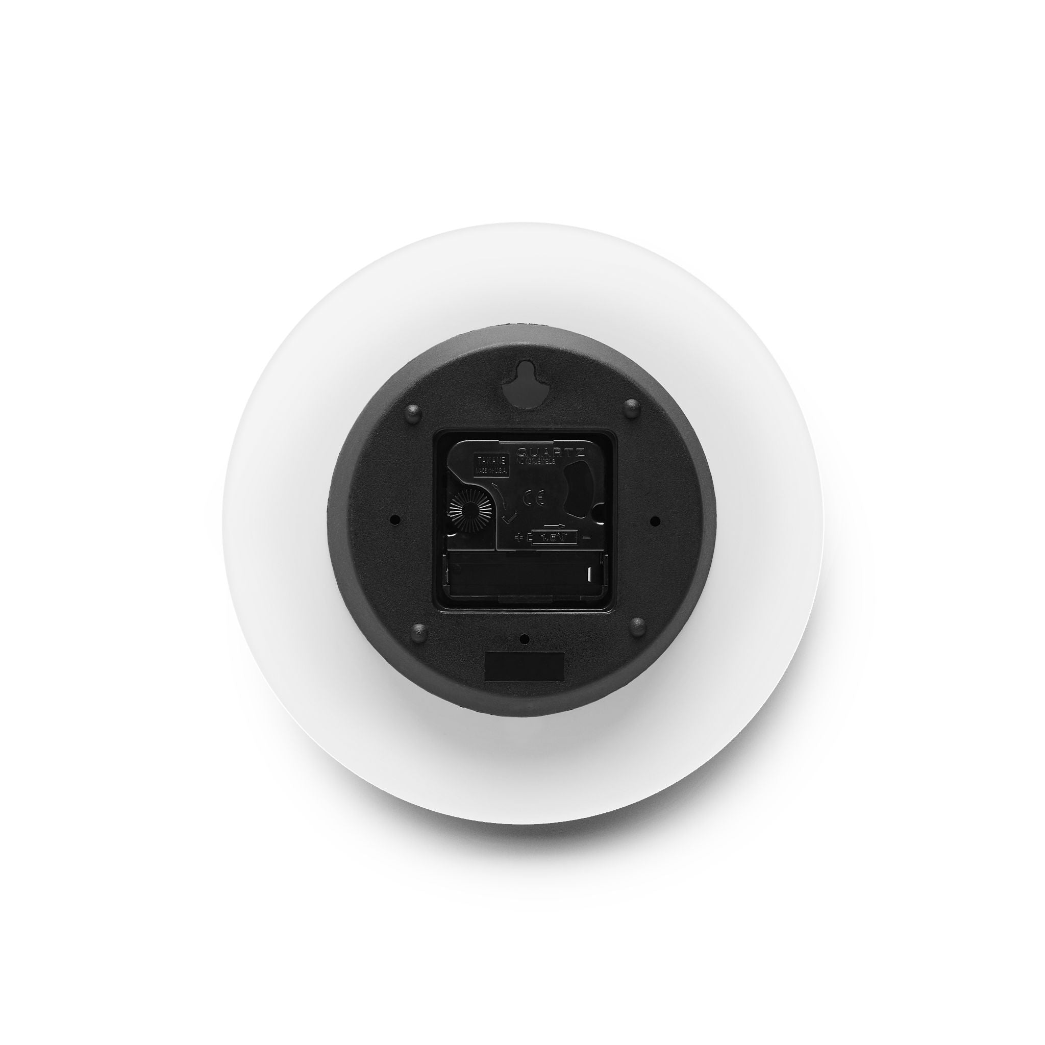 Round white device with black interior on a white background
