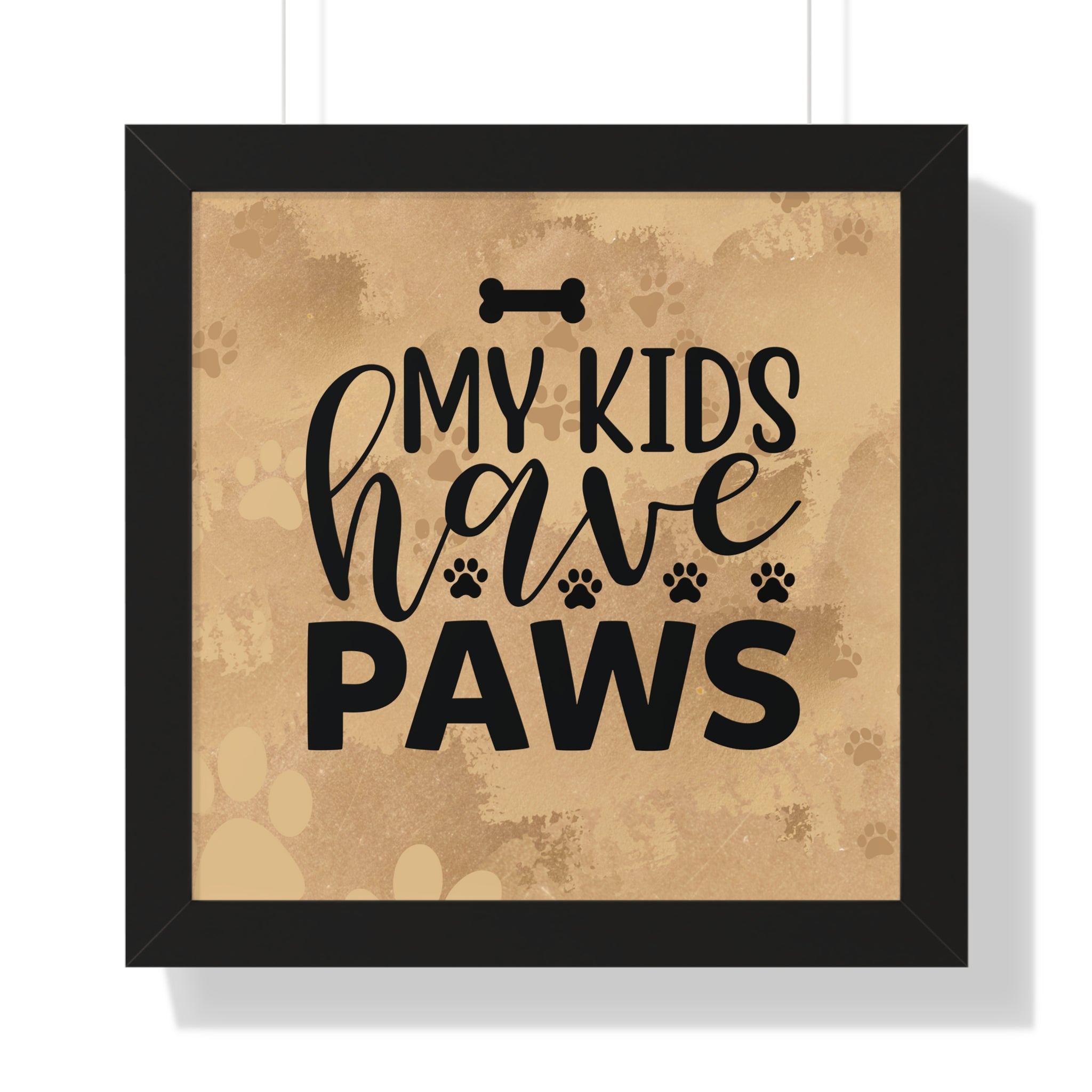 Framed artwork with 'My kids have paws' text on a textured background