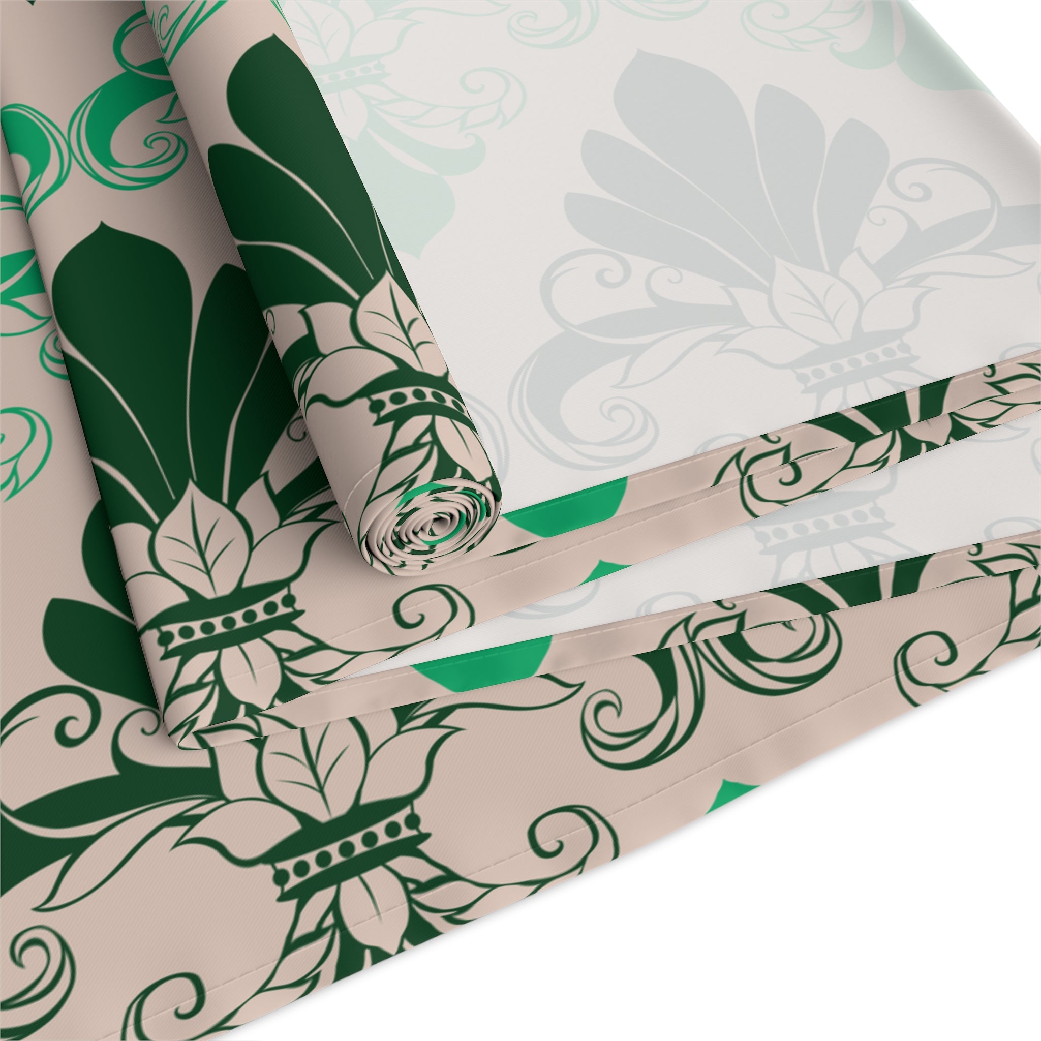 Roll of green and beige floral patterned fabric on a white background