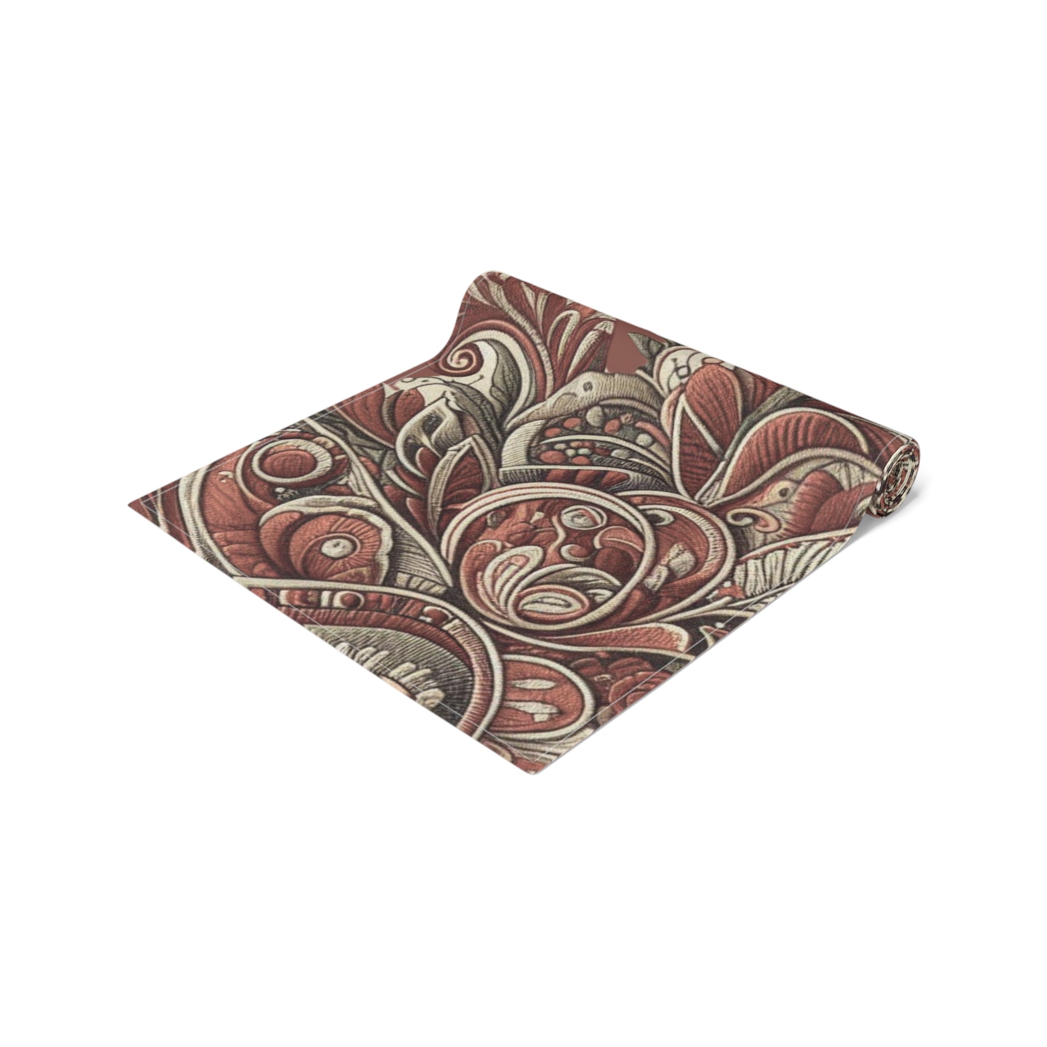 Folded fabric with intricate paisley pattern on a white background