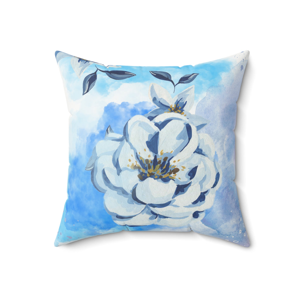 Decorative pillow with a floral design on a blue and white background