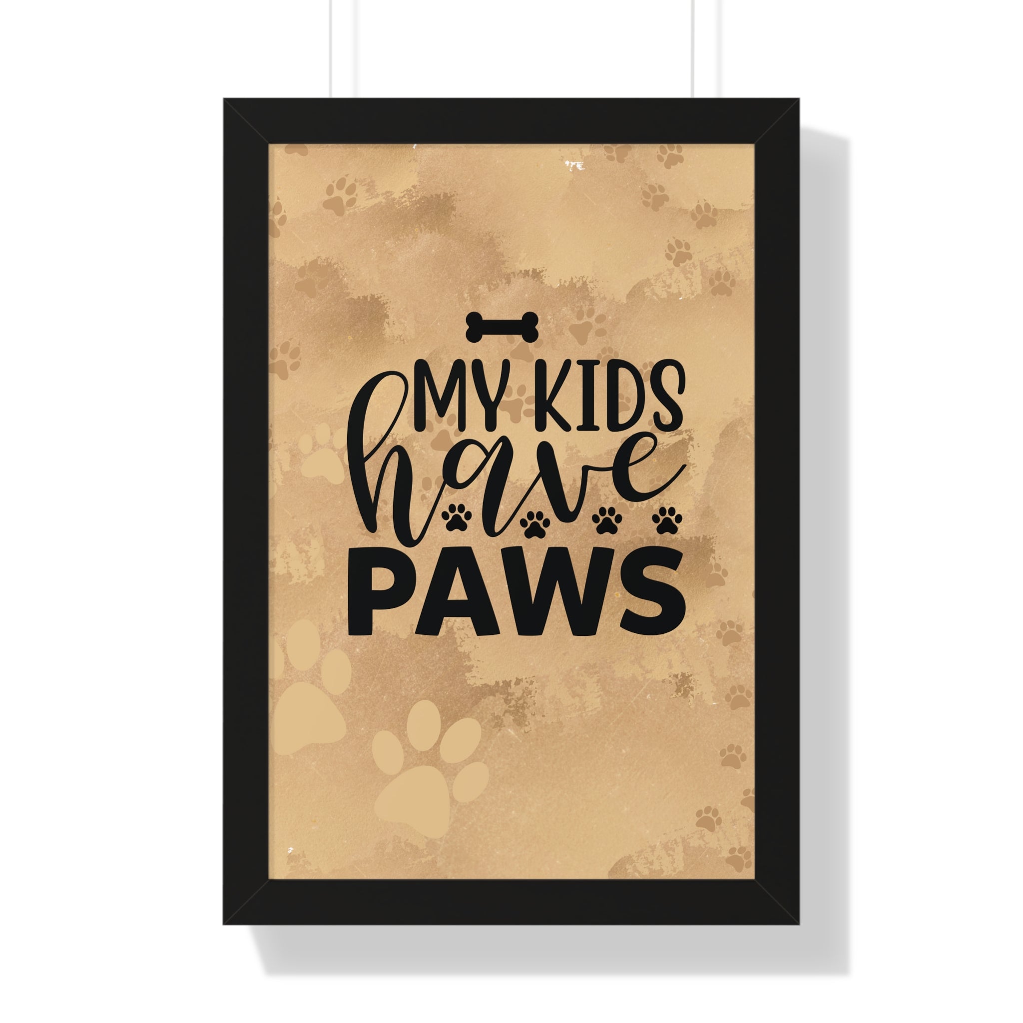 Framed poster with 'My kids have paws' text on a brown background with paw prints.