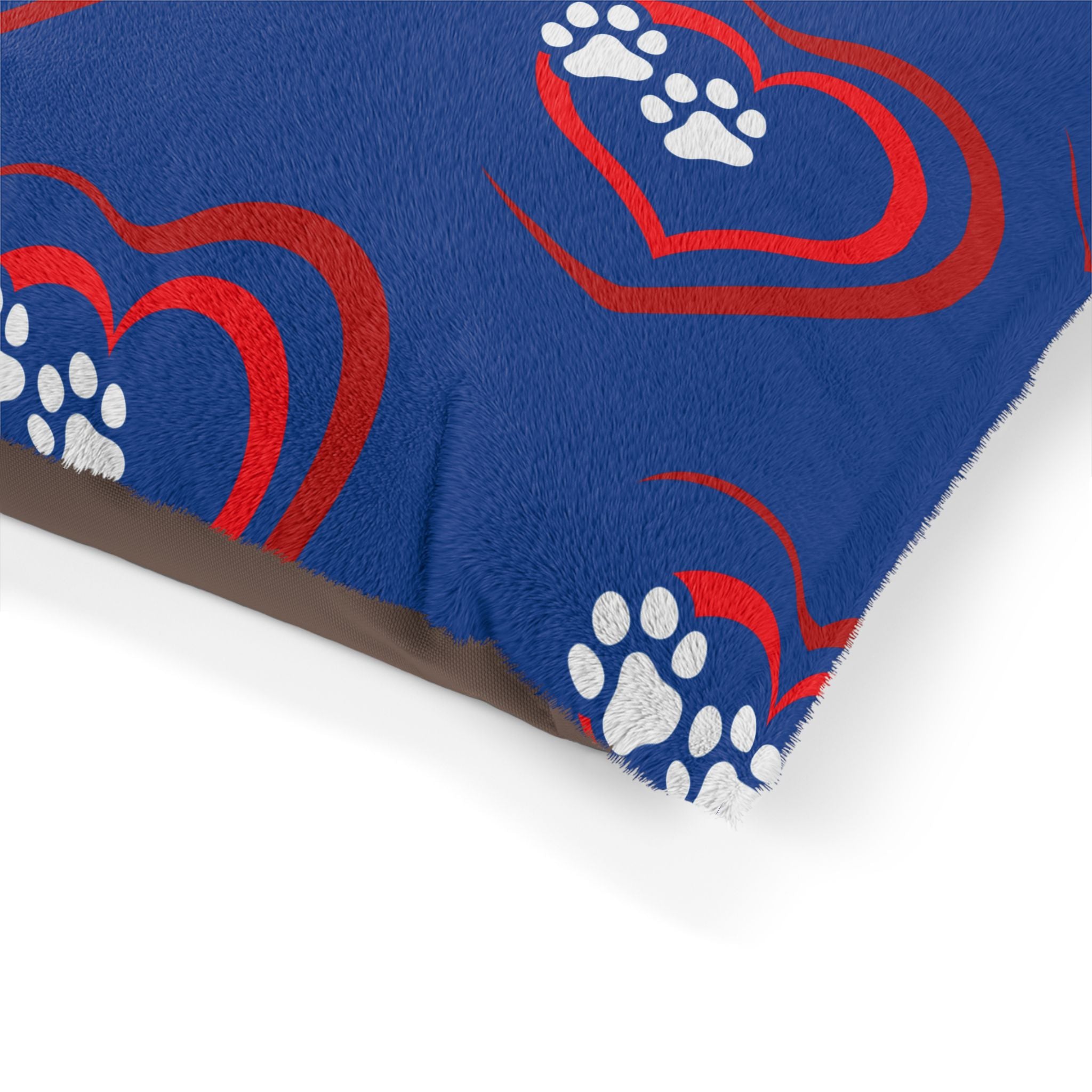 Blue blanket with red hearts and white paw prints on a white background