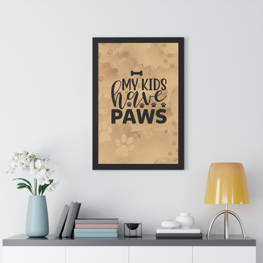 Framed poster with 'My kids have paws' text on a wall above a shelf with decor items.