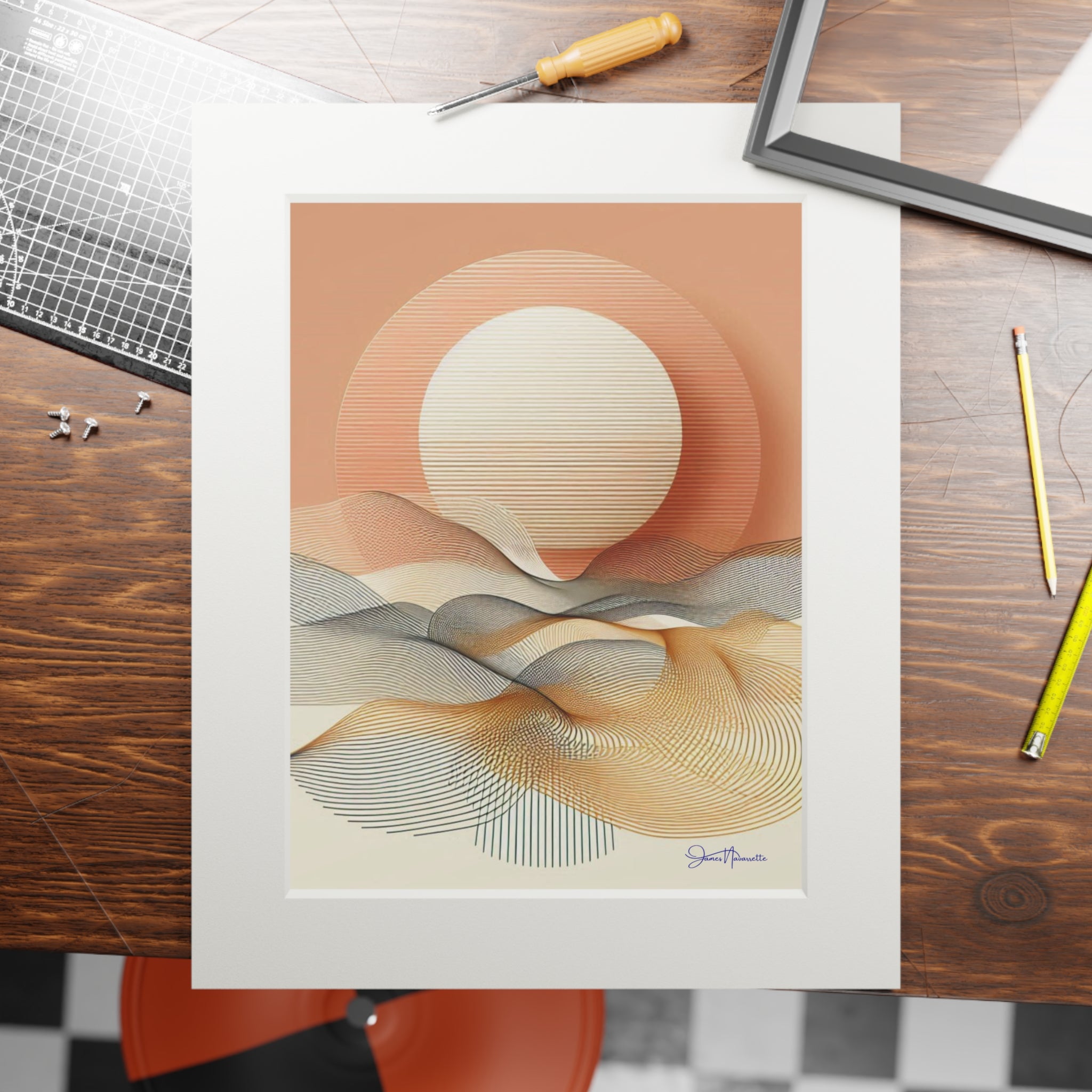Abstract art print on a wooden table with tools