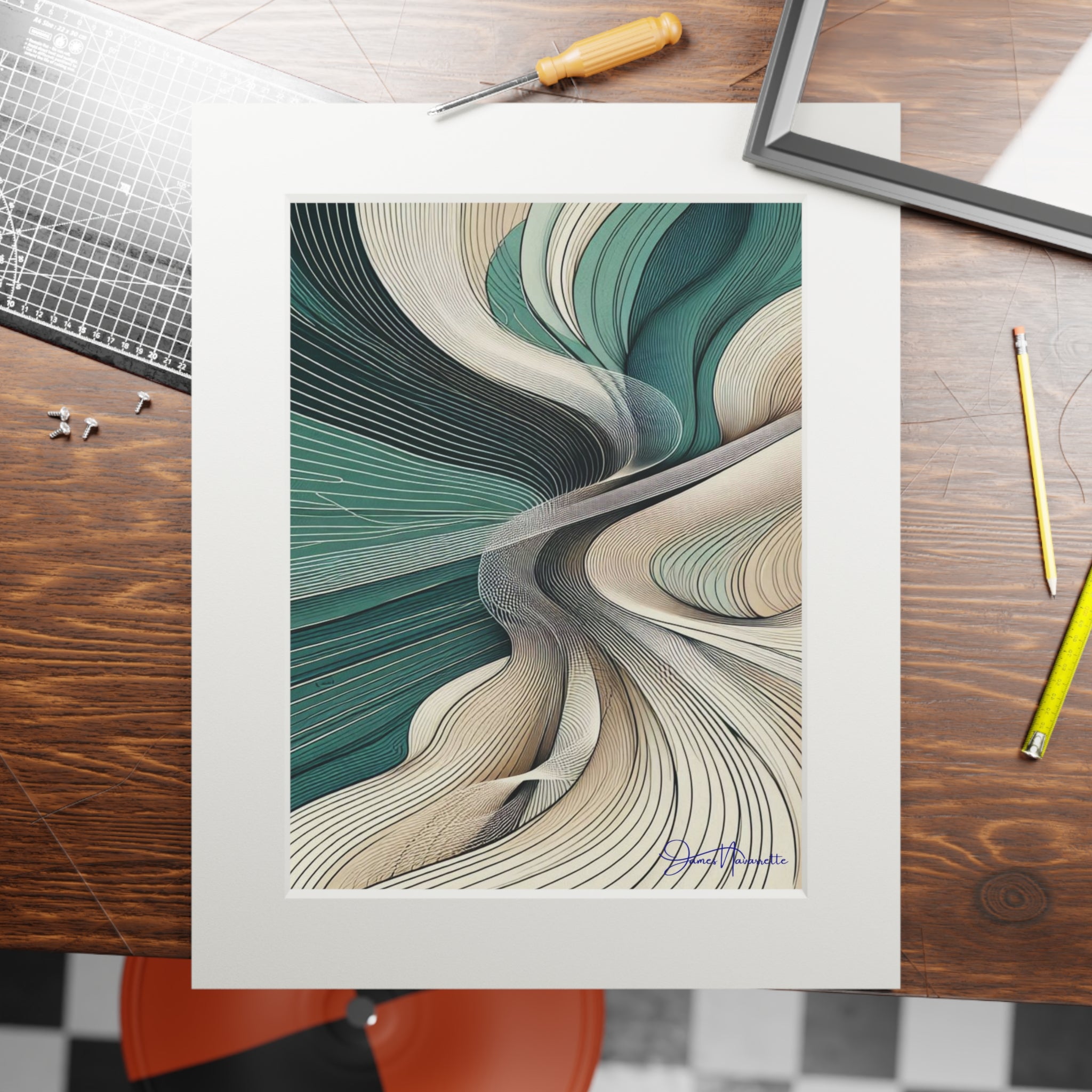 Abstract art print on a wooden table with tools