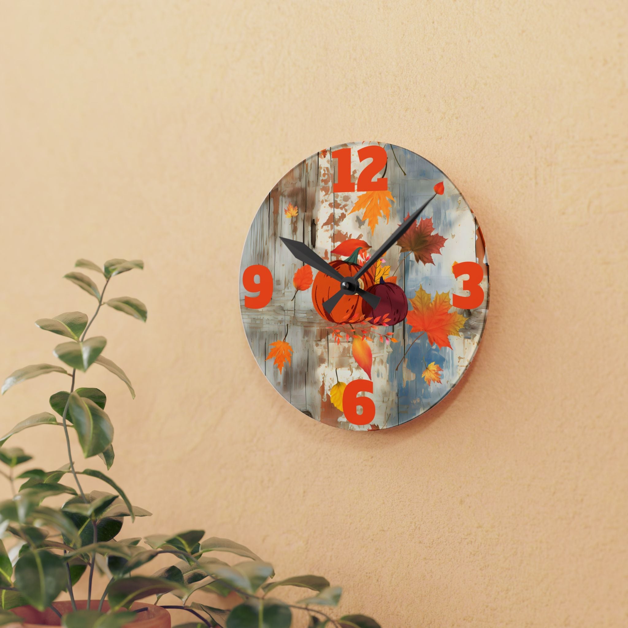 Decorative wall clock with autumn design on a beige wall