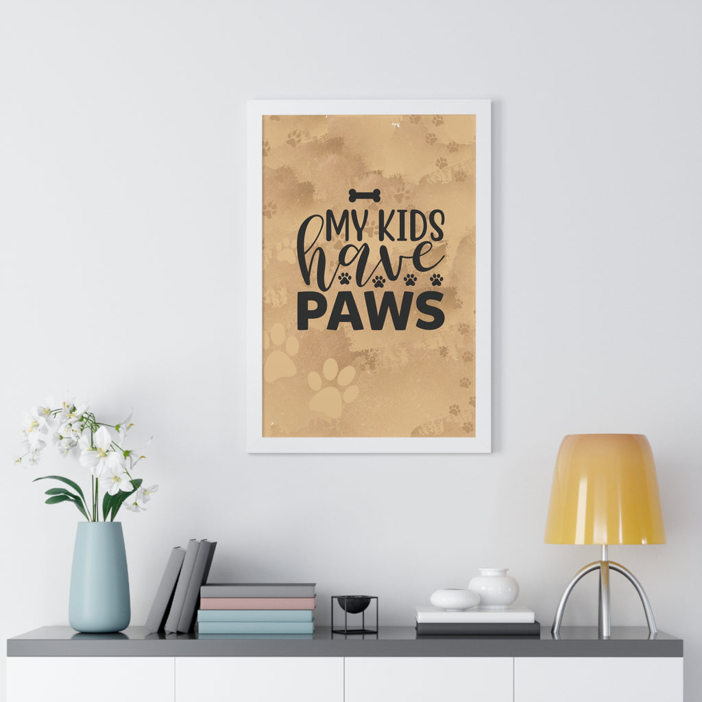 Framed poster with 'My kids have paws' text on a wall above a shelf with decor items.