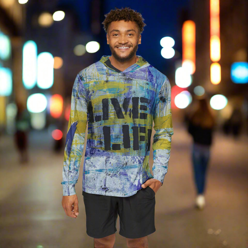 Man wearing a colorful hoodie with 'Live Life' text on a white background