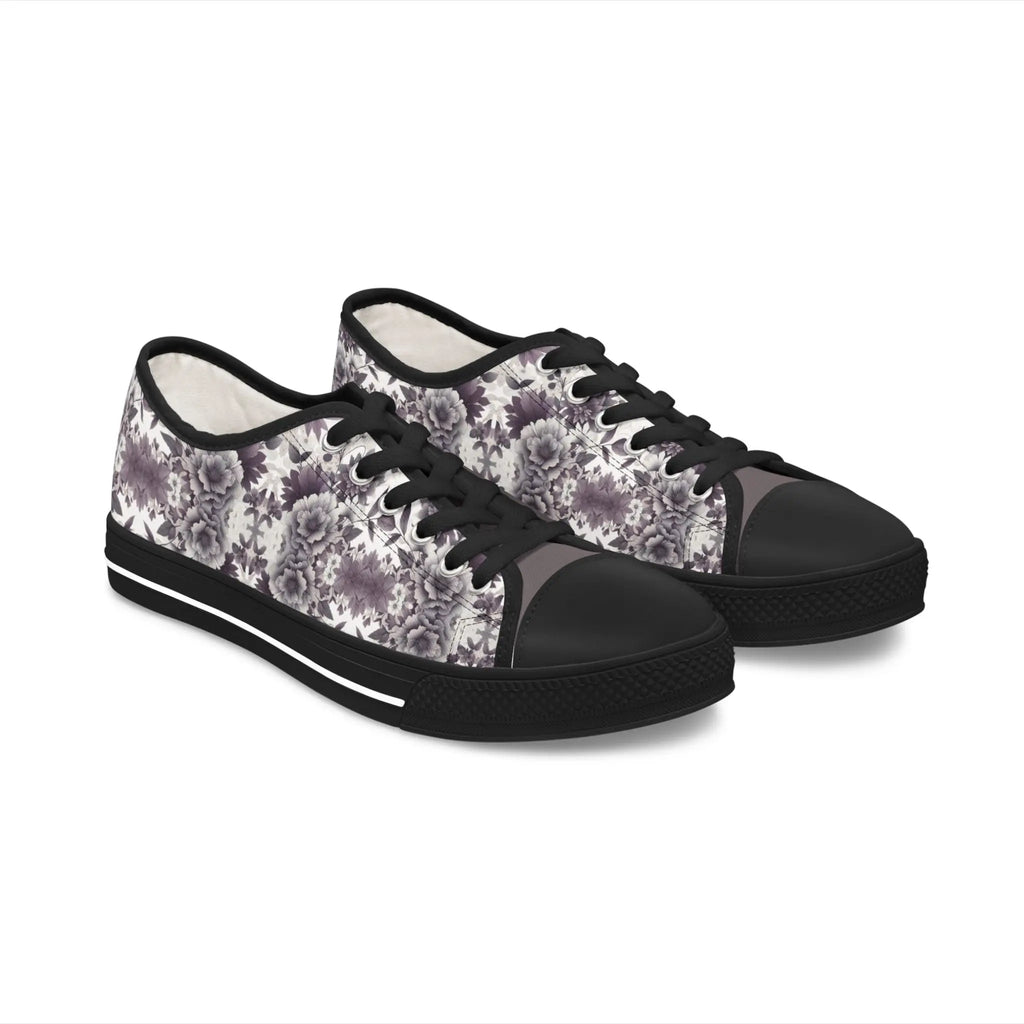 Black sneakers with floral pattern on a white background