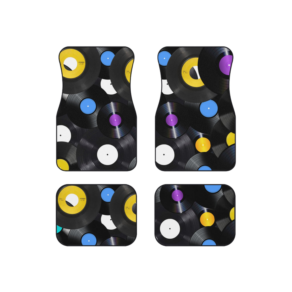 Four car floor mats with vinyl record design on a white background