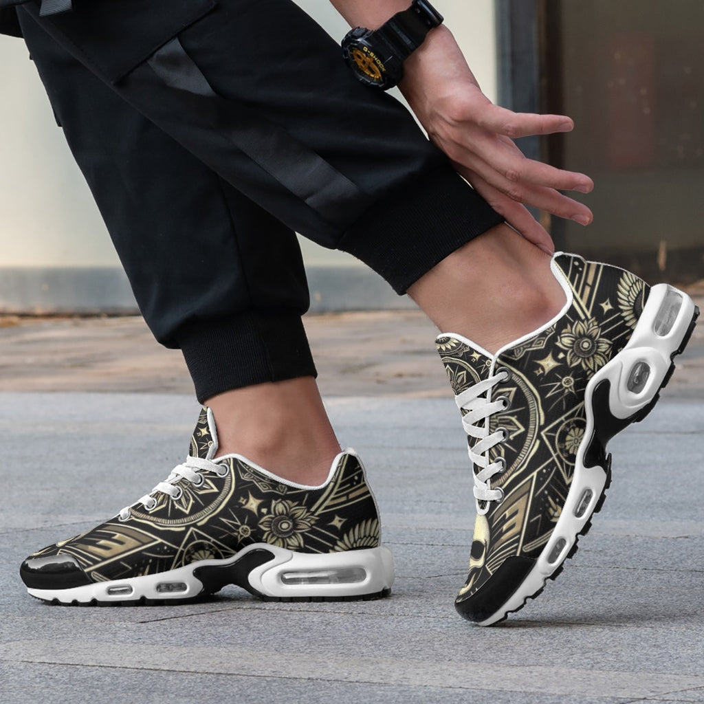 Person wearing black and gold patterned sneakers with white soles on a blurred background