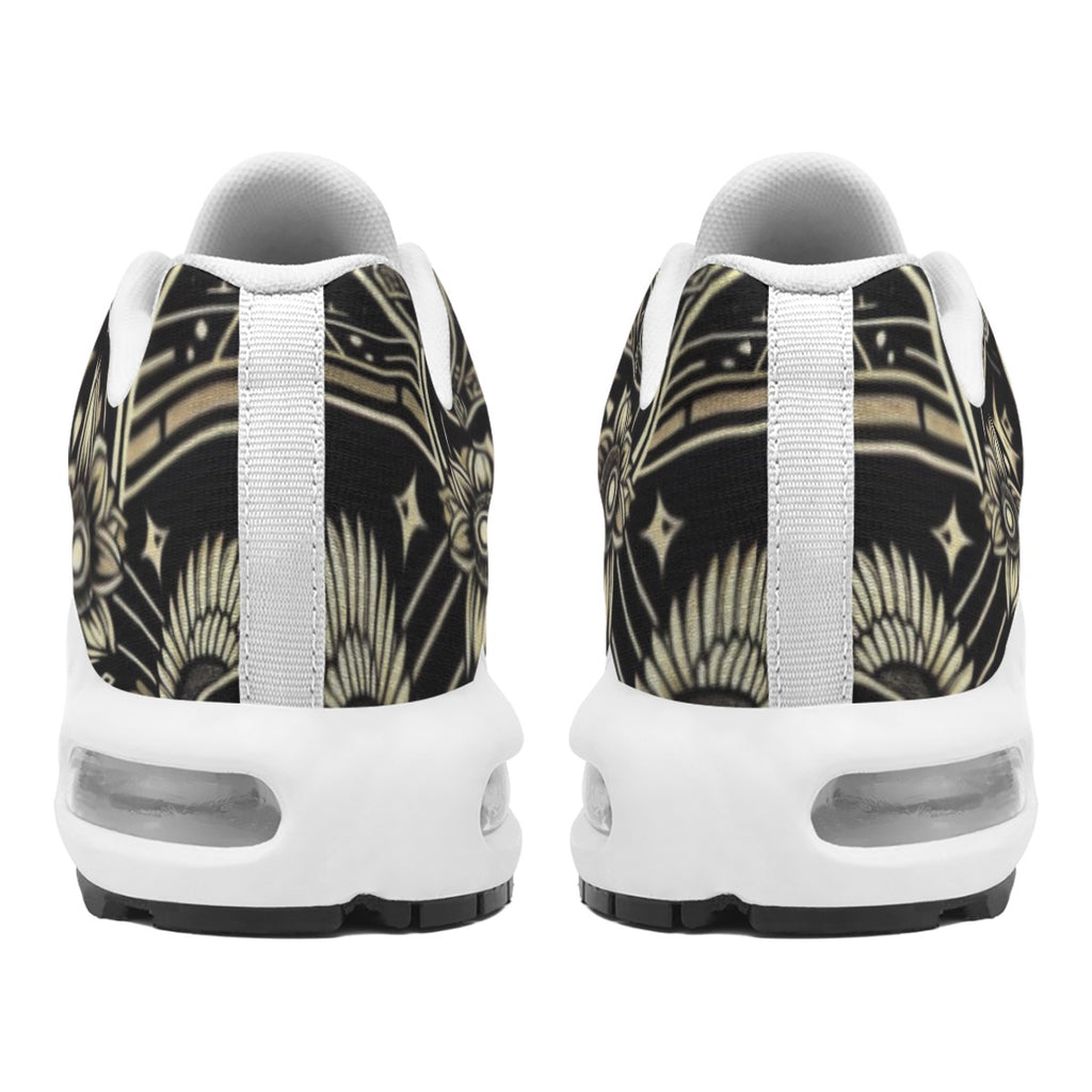 Pair of sneakers with a black and gold pattern on a white background