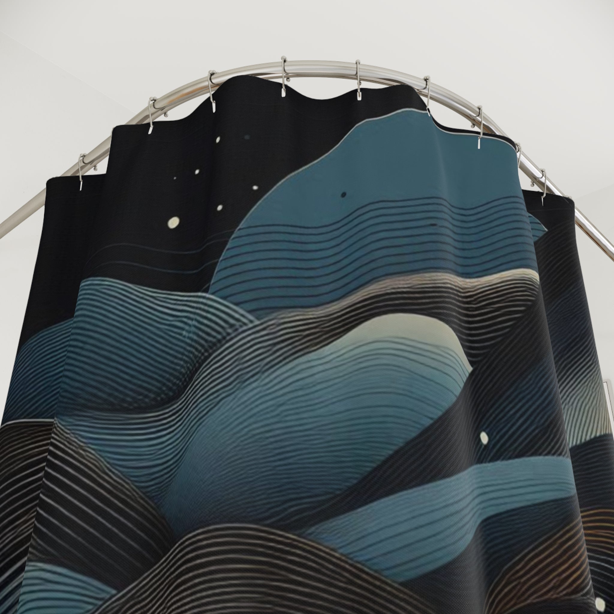 Shower curtain with wavy blue and black pattern on a white background