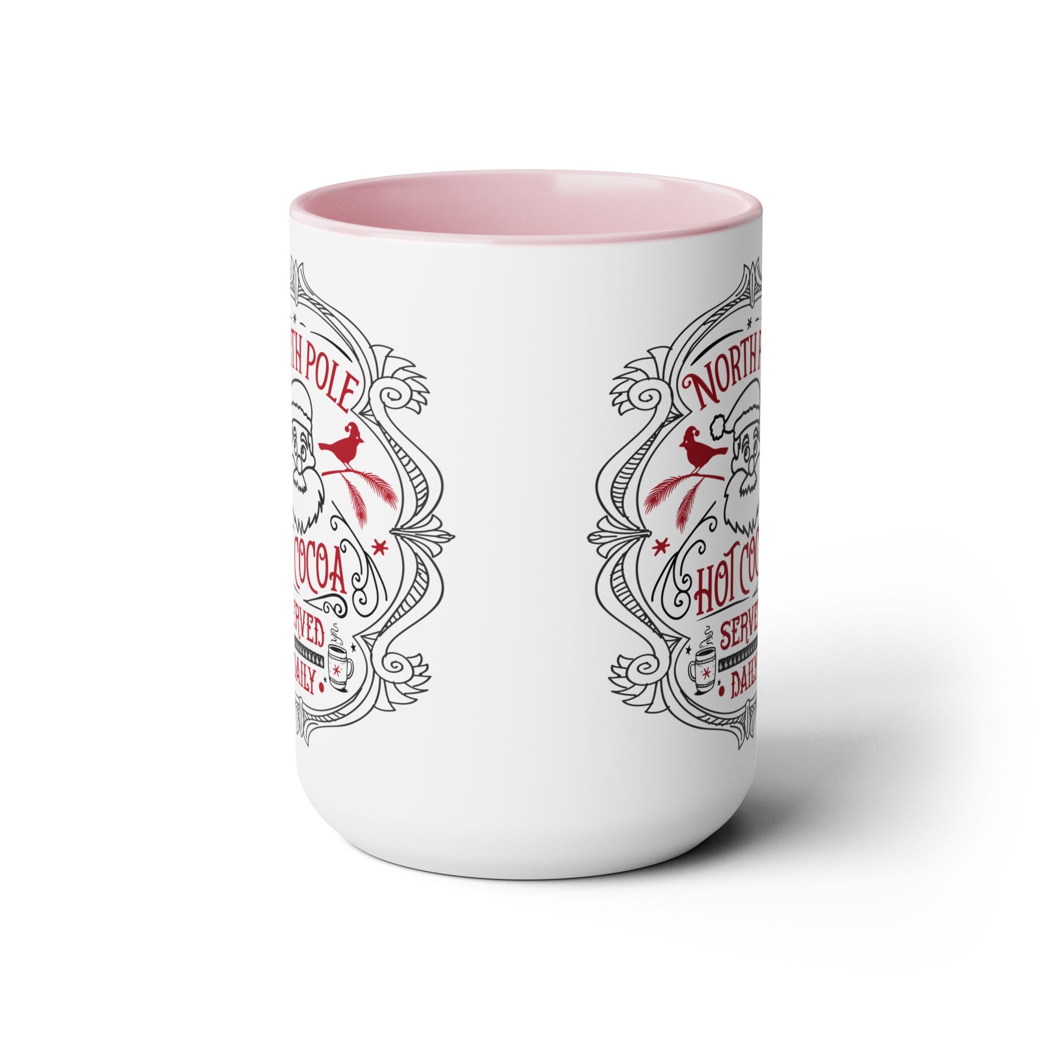 White mug with pink interior and decorative text on a white background