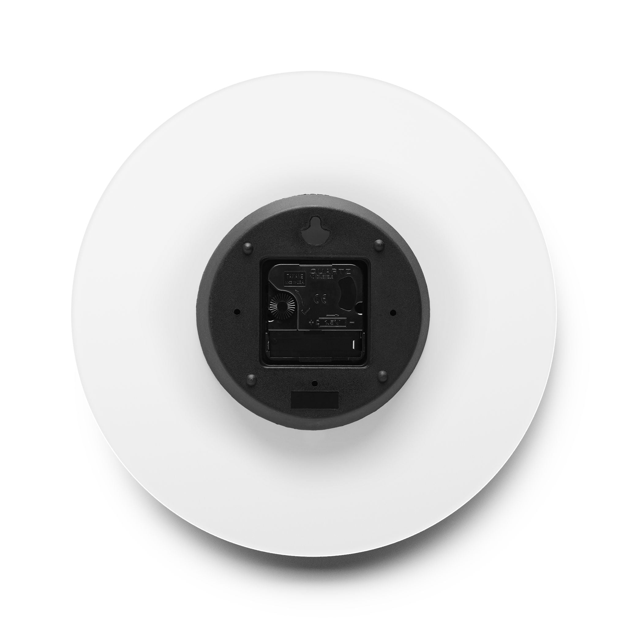 Round white device with black interior on a white background
