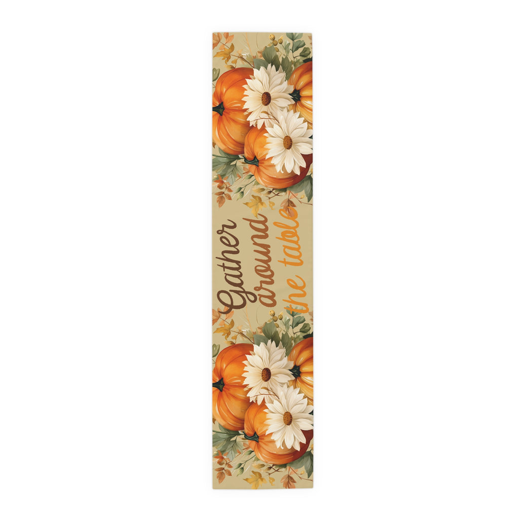 Decorative mat with pumpkins and flowers featuring the text 'Gather around the table' on a white background.