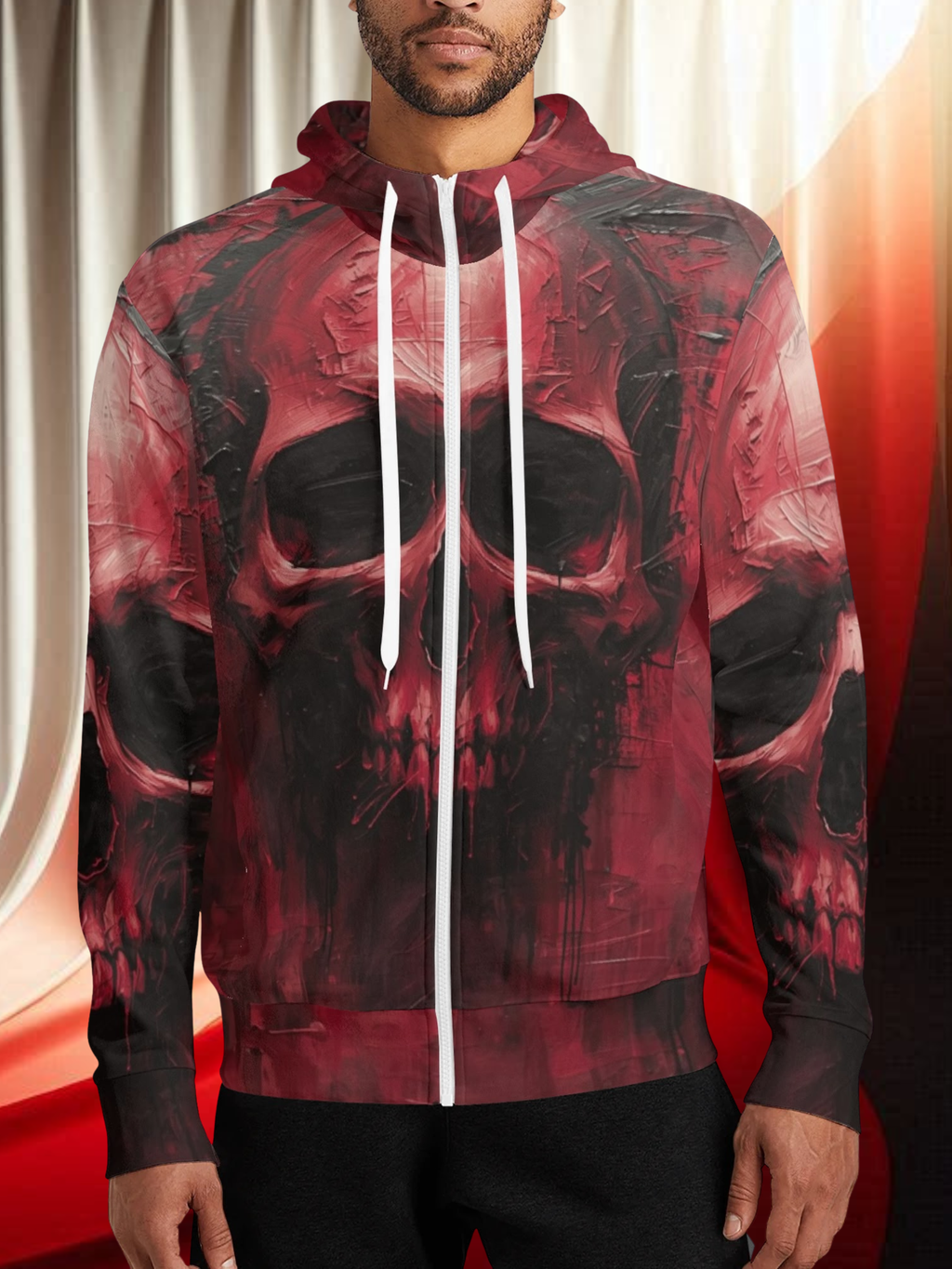 Person wearing a red and black skull-themed hoodie with white drawstrings.