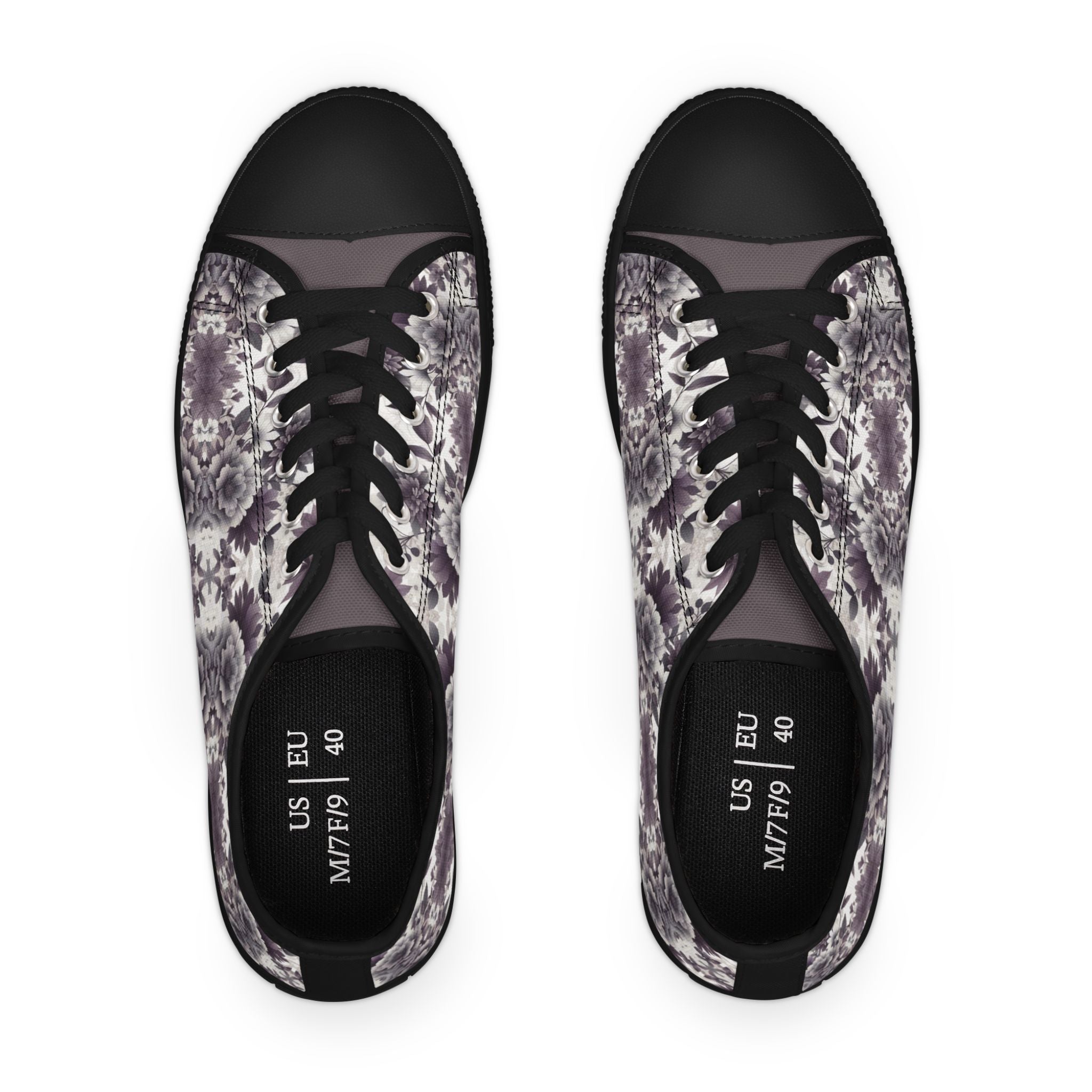 Pair of black sneakers with floral pattern on a white background