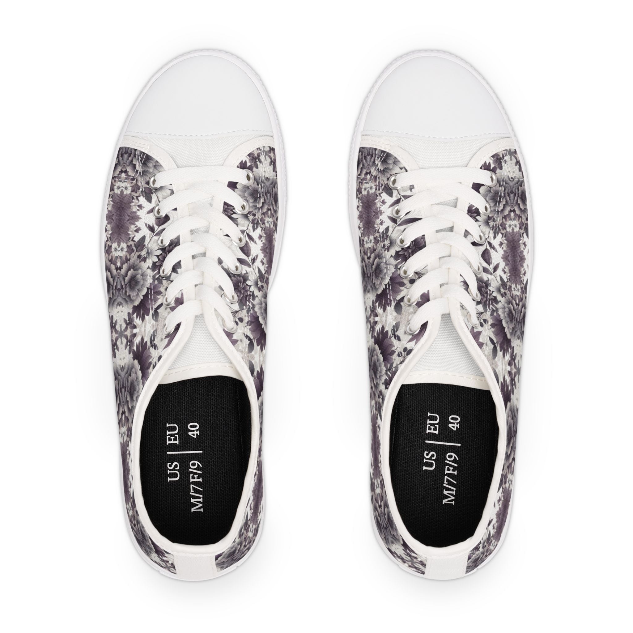 Pair of white sneakers with black and gray floral pattern on a white background