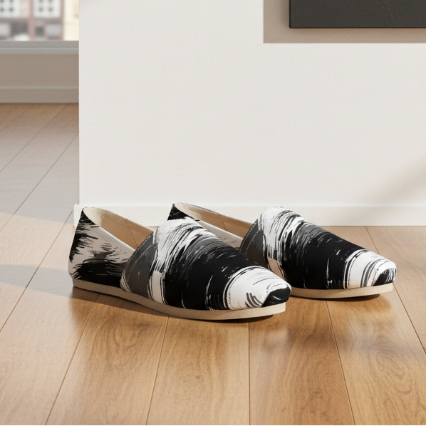 Black and white patterned shoes on a wooden floor with a cityscape view.