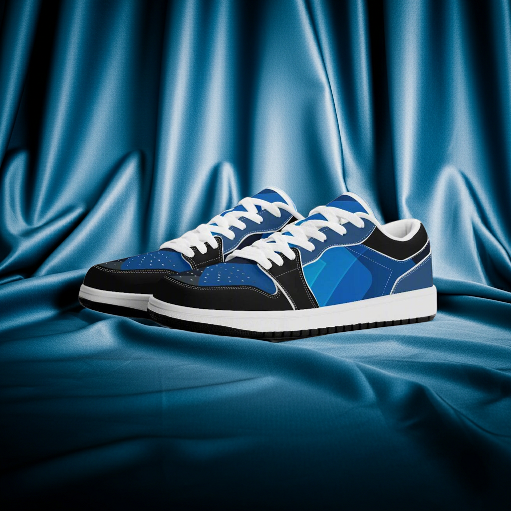 Blue and black sneakers with white laces on a blue fabric background