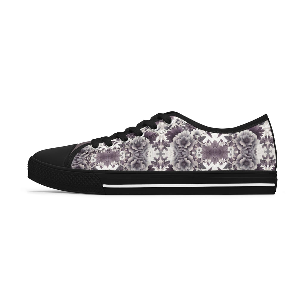 Black sneaker with floral pattern on a white background
