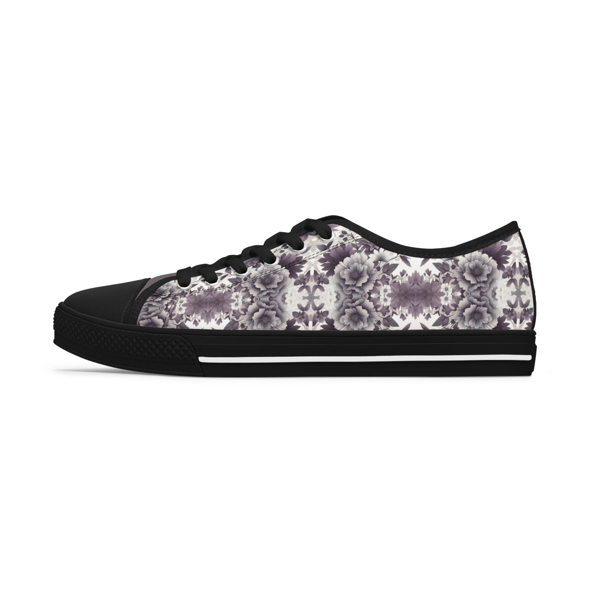 Black sneaker with floral pattern on a white background