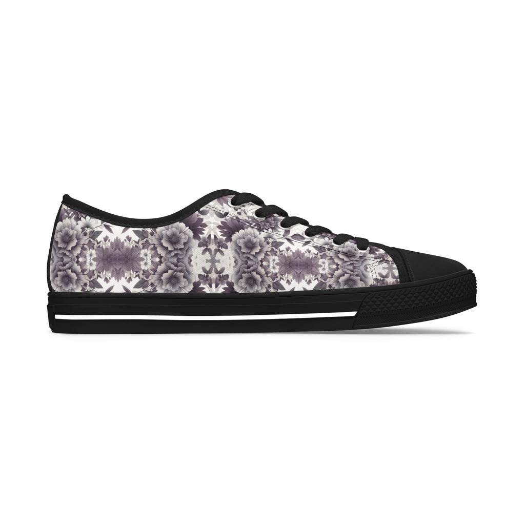 Sneaker with floral pattern and black sole on a white background