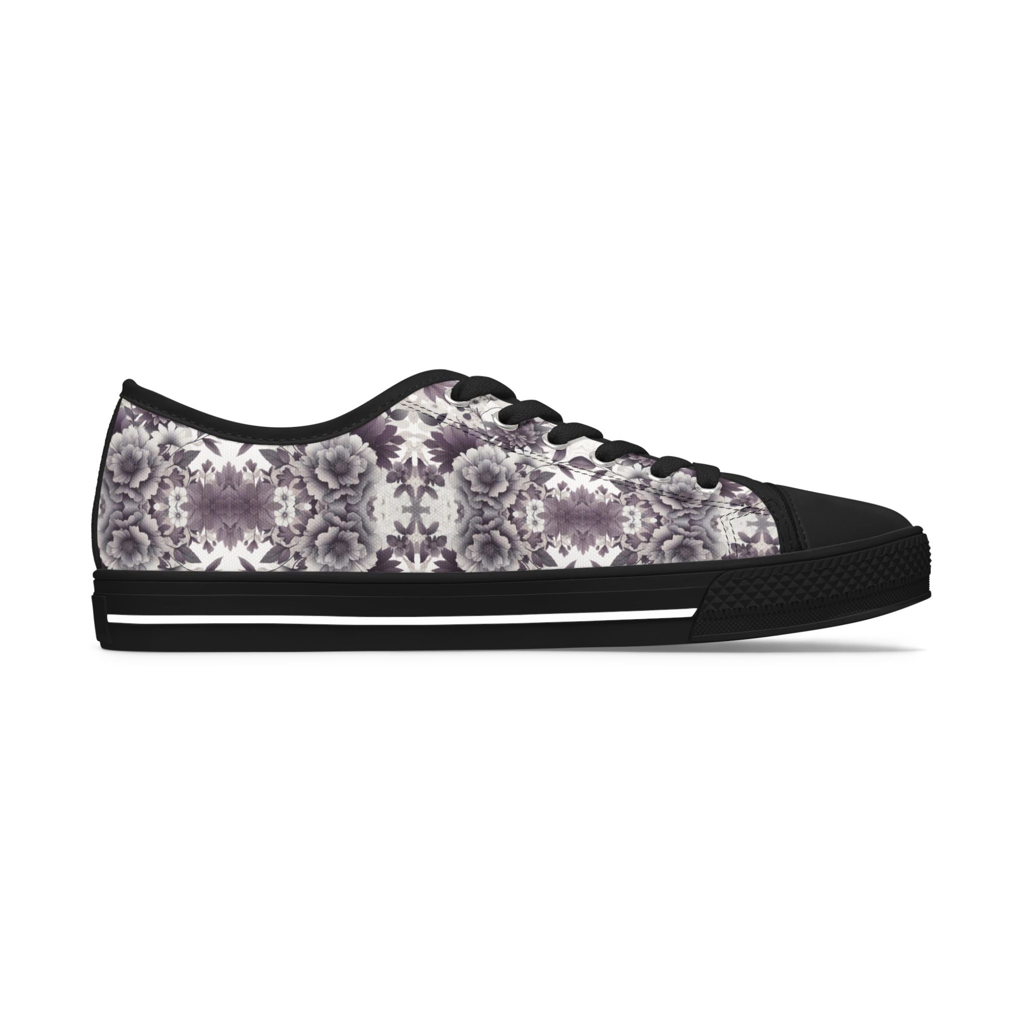 Sneaker with floral pattern and black sole on a white background