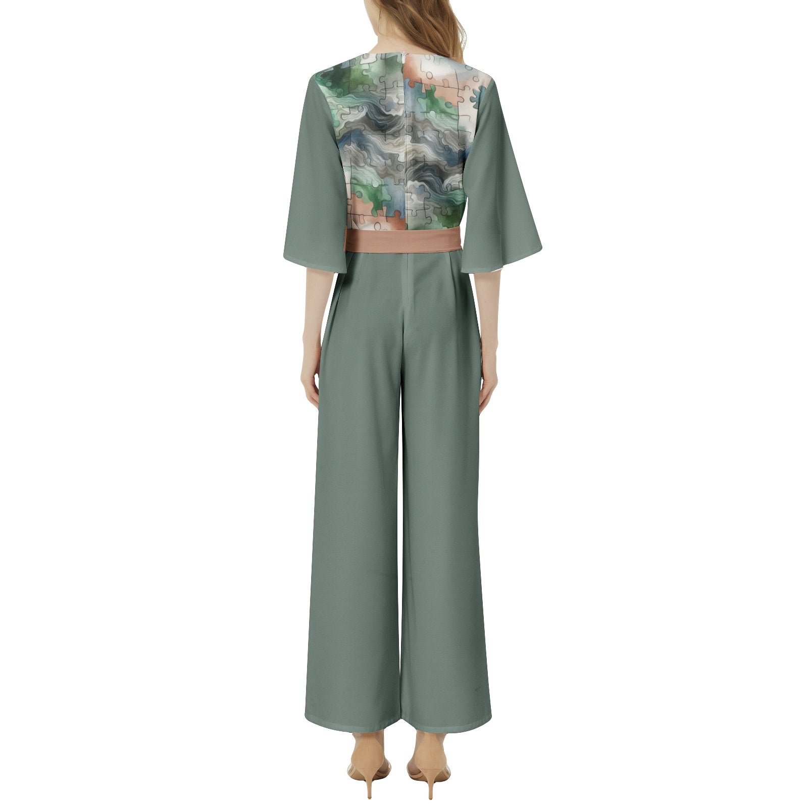 Green jumpsuit with a patterned back on a white background